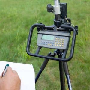 Survey control equipment displaying GPS data while verifying accuracy during construction staking surveys