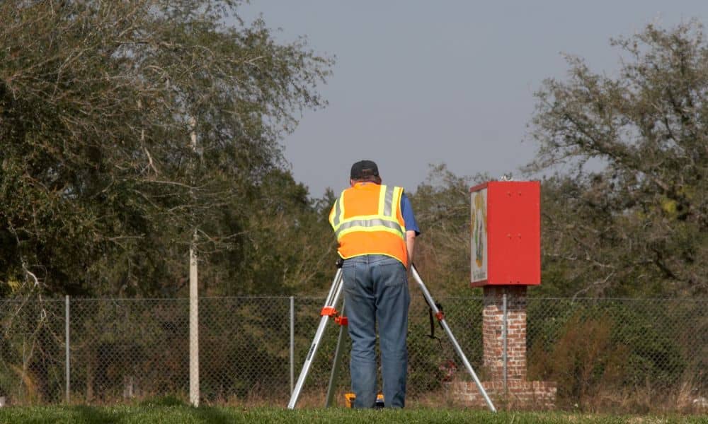 Alta surveyor after extreme weather - ALTA SURVEY Indiana Land surveyor conducting an alta survey to inspect property boundaries after extreme weather and flooding