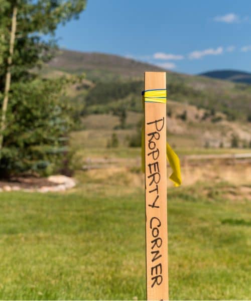 Property corner stake on surveyed land - ALTA SURVEY Indiana Property corner stake marking a surveyed boundary line on a clear and open site