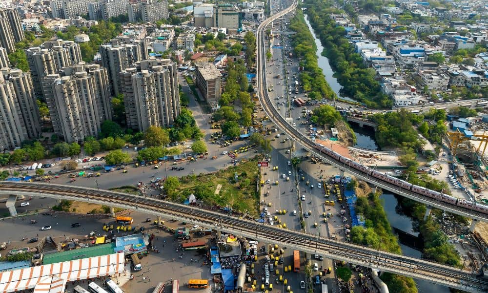 Aerial view of urban highway overpass and surrounding development showing complex site conditions for an alta land survey